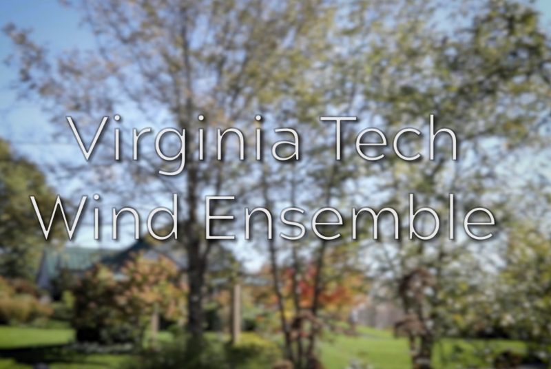 A photograph of a landscape with green grass and trees, with the words 'Virginia Tech Wind Ensemble'